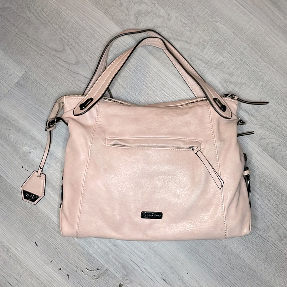 Baby pink tote bag with a cheetah print interior.